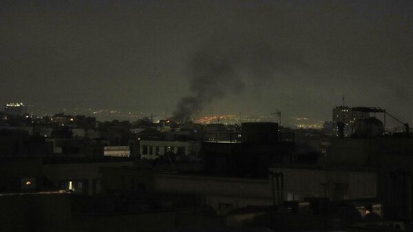 Smoke rises up to the sky, in Tehran, Iran, Friday, June 13, 2025.  - Sputnik International