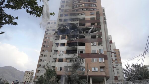 Damages are seen in a building after an explosion in a residence compound after Israel attacked Iran's capital Tehran, Friday, June 13, 2025. - Sputnik International