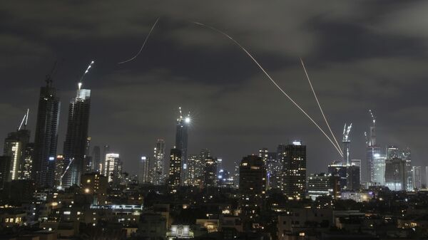 The Israeli Iron Dome air defense system fires to intercept missiles over Tel Aviv, Israel, Sunday, June 15, 2025. - Sputnik International