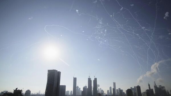 Israeli air defense system fires to intercept missiles during an Iranian attack over Tel Aviv, Israel, Thursday, June 19, 2025.  - Sputnik International