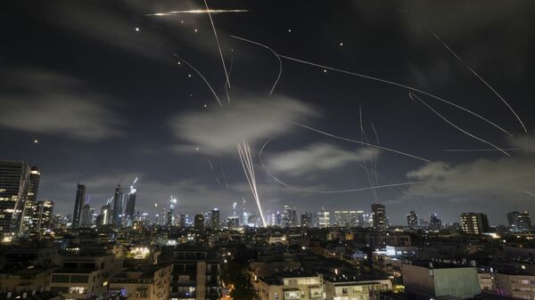 The Israeli Iron Dome air defense system fires to intercept missiles during an Iranian attack over Tel Aviv, Israel. - Sputnik International
