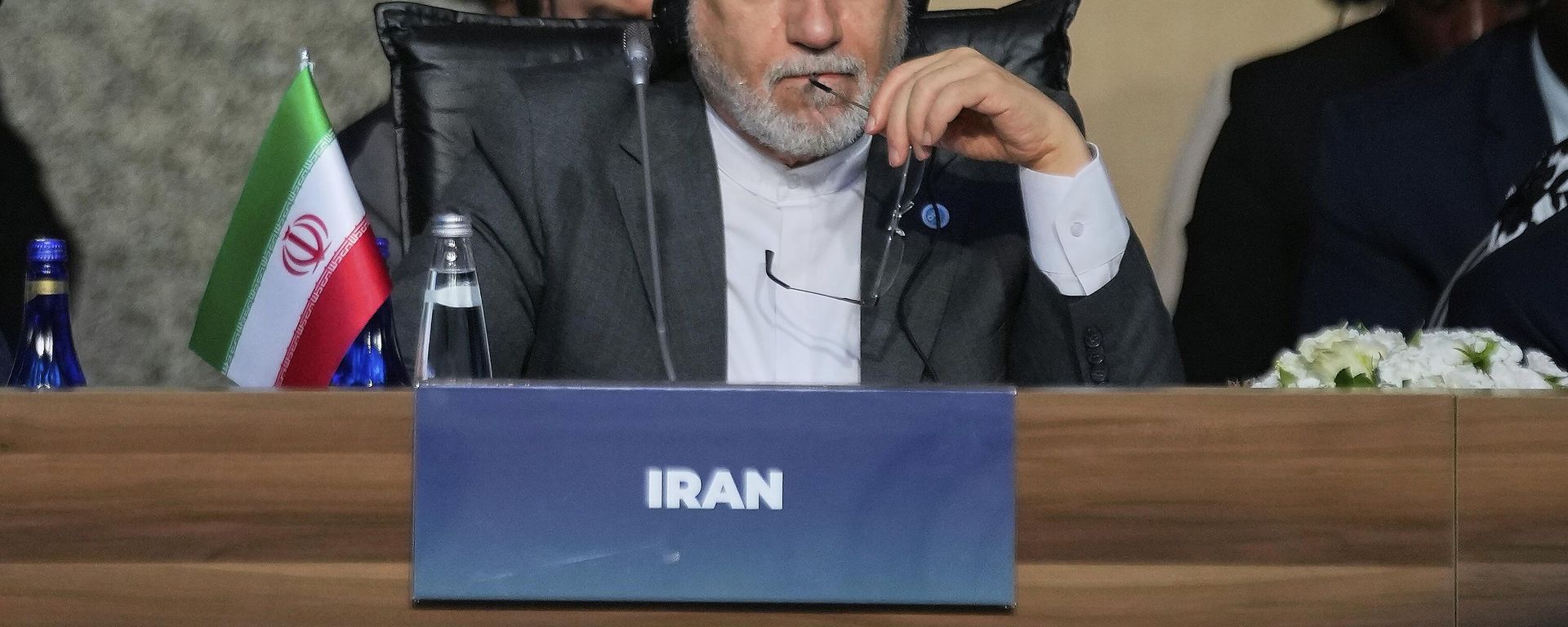 Iranian Foreign Minister Abbas Araghchi listens to speeches as he attends the Council of Foreign Ministers of the Organization of Islamic Cooperation meeting, in Istanbul, Turkey, Saturday, June 21, 2025.  - Sputnik International, 1920, 16.03.2026