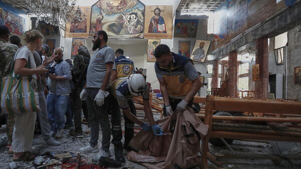 Syrian Civil Defence workers remove body remains inside Mar Elias church where a suicide bomber detonated himself in Dweil'a in the outskirts of Damascus, Syria, Sunday June 22, 2025. - Sputnik International