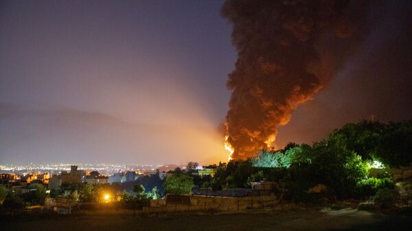  Fire and smoke rise into the sky after an Israeli attack on the Shahran oil depot on June 15 - Sputnik International