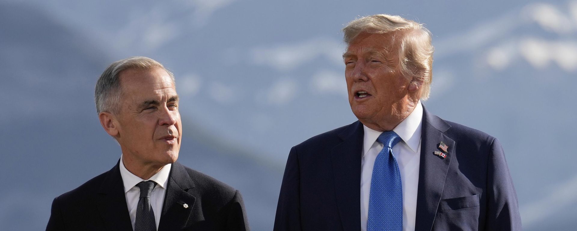 Canada's Prime Minister Mark Carney, listens as President Donald Trump speaks during a group photo at the G7 Summit, Monday, June 16, 2025, in Kananaskis, Canada - Sputnik International, 1920, 23.08.2026
