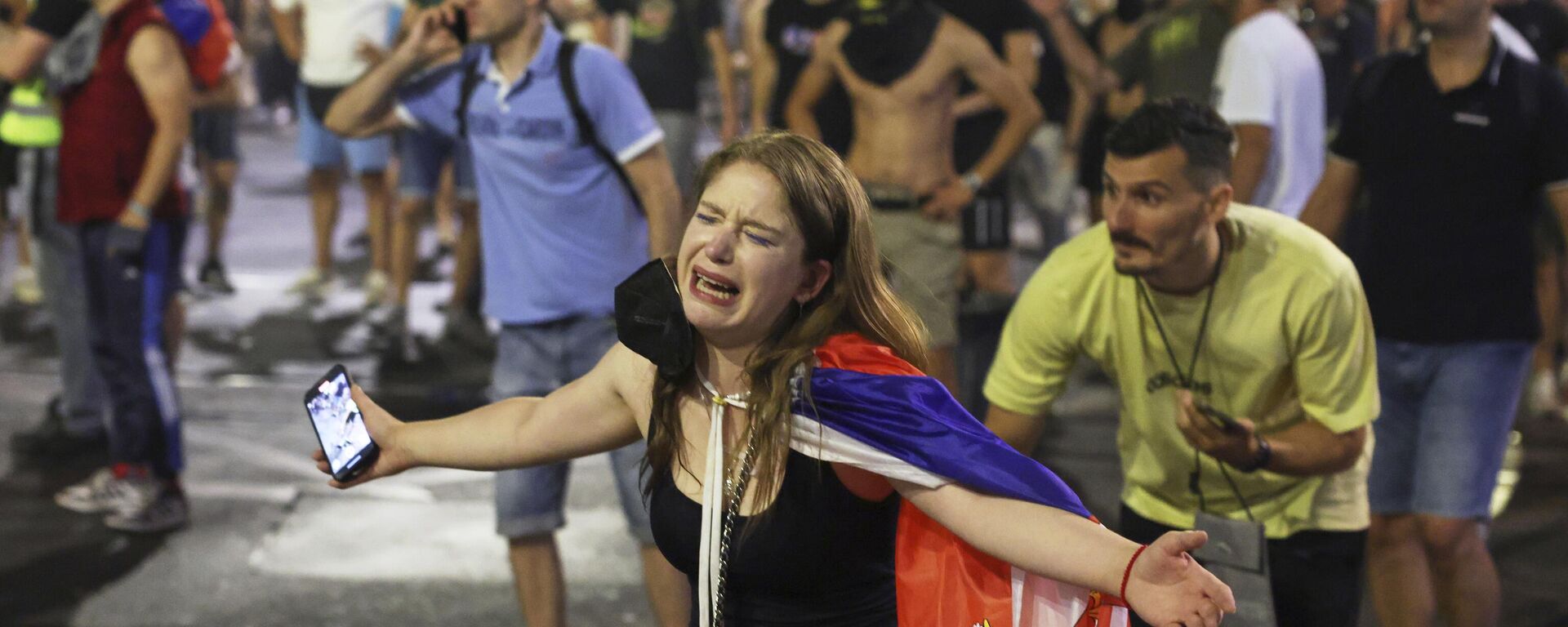 People react at the end of a rally pressing for an early election after nearly eight months of almost daily anti-corruption demonstrations that have shaken the government of President in Belgrade, Serbia, Saturday, June 28, 2025 - Sputnik International, 1920, 30.06.2025