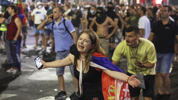 People react at the end of a rally pressing for an early election after nearly eight months of almost daily anti-corruption demonstrations that have shaken the government of President in Belgrade, Serbia, Saturday, June 28, 2025 - Sputnik International