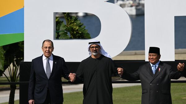 Russian Foreign Minister Sergey Lavrov, Abu Dhabi Crown Prince Sheikh Khaled bin Mohammed bin Zayed Al Nahyan, and Indonesian President Prabowo Subianto (from left to right) during the group photo of participants at the 17th BRICS Summit chaired by Brazil in Rio de Janeiro. - Sputnik International