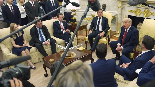 President Donald Trump, from right, speaks during a meeting with NATO Secretary General Mark Rutte in the Oval Office of the White House, Monday, July 14, 2025, in Washington.  - Sputnik International