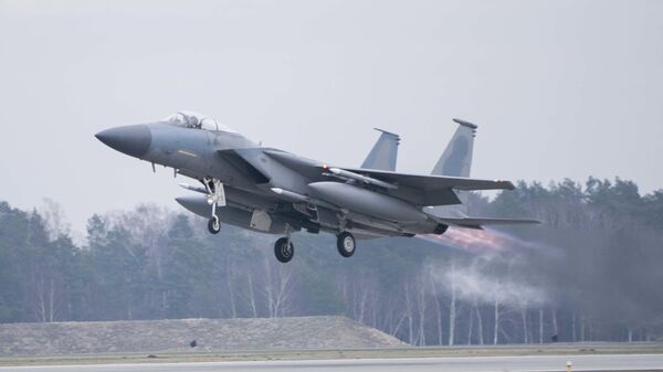 In this image provided by the US Air Force, a US Air Force F-15C Eagle assigned to the 493rd Fighter Squadron, Royal Air Force (RAF) Lakenheath, takes off in support of North Atlantic Treaty Organization enhanced air policing missions with the Polish Air Force at Lask Air Base, Poland, Feb. 15, 2022 - Sputnik International