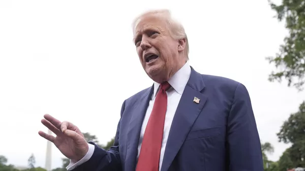 President Donald Trump talks to reporters on the South Lawn of the White House before he boards Marine One en route to Joint Base Andrews, Md., Friday, Aug. 1, 2025, in Washington - Sputnik International