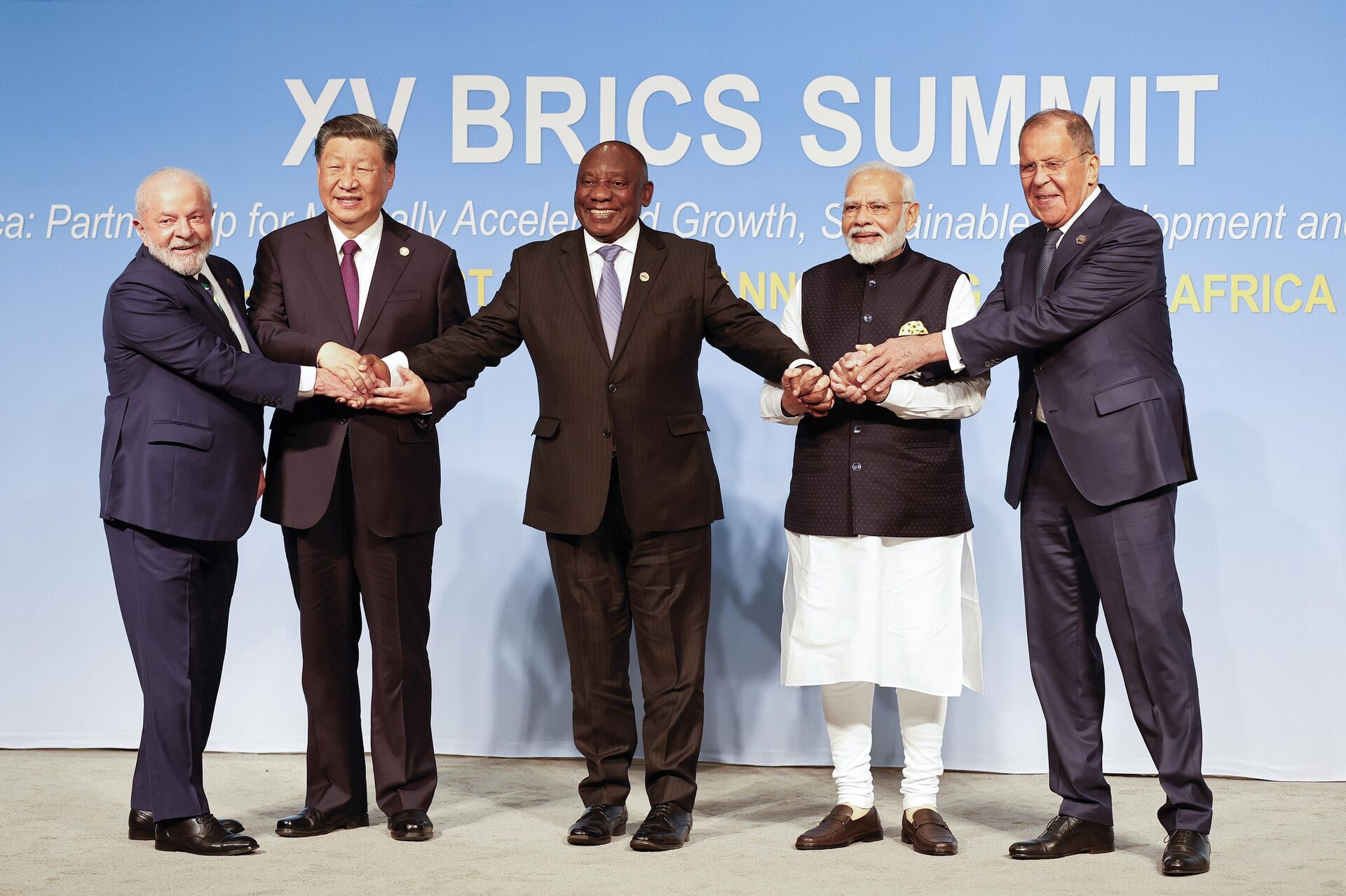From left, Brazil President Luiz Inacio Lula da Silva, China President Xi Jinping, South African President Cyril Ramaphosa, Prime Minister of India Narendra Modi and Russia's Foreign Minister Sergei Lavrov pose for a BRICS family photo during the 2023 BRICS Summit at the Sandton Convention Centre in Johannesburg, South Africa, Wednesday, Aug. 23, 2023.  - Sputnik International, 1920, 04.09.2025
