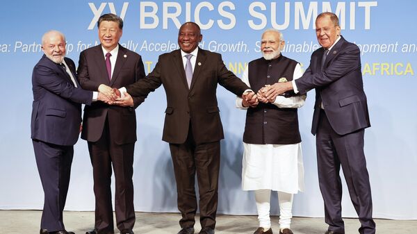 From left, Brazil President Luiz Inacio Lula da Silva, China President Xi Jinping, South African President Cyril Ramaphosa, Prime Minister of India Narendra Modi and Russia's Foreign Minister Sergei Lavrov pose for a BRICS family photo during the 2023 BRICS Summit at the Sandton Convention Centre in Johannesburg, South Africa, Wednesday, Aug. 23, 2023.  - Sputnik International