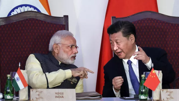 Indian Prime Minister Narendra Modi, left, talks with Chinese President Xi Jinping at a signing ceremony by foreign ministers during the BRICS summit in Goa, India, Oct. 16, 2016. - Sputnik International