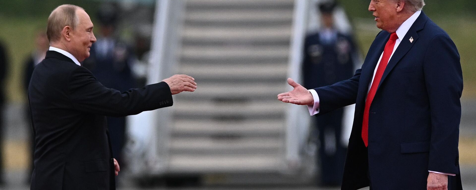 US President Donald Trump greets Russian President Vladimir Putin on the tarmac after they arrived to attend a meeting at Joint Base Elmendorf-Richardson in Anchorage, Alaska, the United States. - Sputnik International, 1920, 16.08.2025