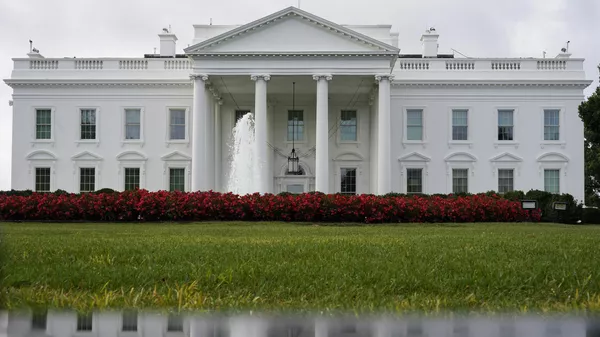 The White House is seen reflected in a puddle, Saturday, Sept. 3, 2022, in Washington.  - Sputnik International