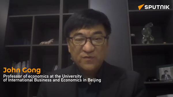 John Gong, Professor of economics at the University of International Business and Economics in Beijing - Sputnik International