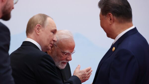 September 1, 2025. Russian President Vladimir Putin, Indian Prime Minister Narendra Modi and President of the People's Republic of China Xi Jinping (from left to right) at the ceremony of the official meeting between President of the People's Republic of China Xi Jinping and the heads of delegations participating in the meeting of the Council of Heads of State of the Shanghai Cooperation Organization (SCO) in Tianjin. - Sputnik International
