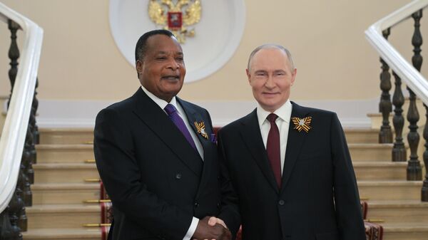 Russian President Vladimir Putin and President of the Republic of Congo Denis Sassou Nguesso (left) during a meeting in the Kremlin before the military parade dedicated to the 80th anniversary of the Victory. On May 9, Russia celebrates the 80th anniversary of Victory in the Great Patriotic War of 1941-1945. - Sputnik International