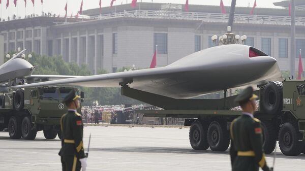 A GJ-11, stealth unmanned combat aerial vehicle takes part in a military parade to commemorate the 80th anniversary of Japan's World War II surrender held in front of Tiananmen Gate in Beijing, Wednesday, Sept. 3, 2025. (AP Photo/Andy Wong) - Sputnik International