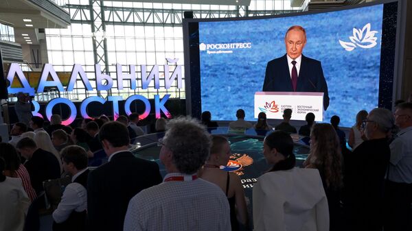 Russian President Vladimir Putin appears on a screen as he delivers a speech during a plenary session of the 2025 Eastern Economic Forum (EEF) at the Far Eastern Federal University on Russky Island in Vladivostok, Russia. - Sputnik International