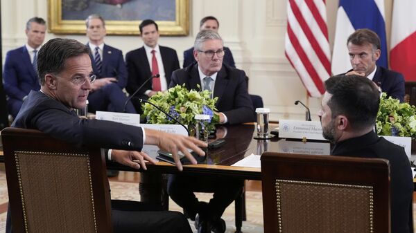 NATO Secretary General Mark Rutte, foreground left, speaks as Ukrainian President Volodymyr Zelenskyy, foreground right, British Prime Minister Keir Starmer, center left, and France's President Emmanuel Macron, center right NATO Secretary General Mark Rutte, foreground left, speaks as Ukrainian President Volodymyr Zelenskyy, foreground right, British Prime Minister Keir Starmer, center left, and France's President Emmanuel Macron, center right - Sputnik International