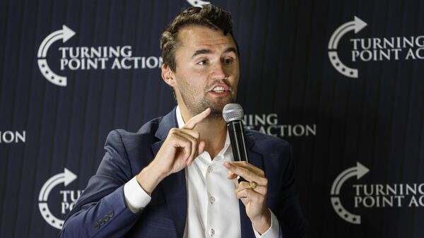 Conservative activist Charlie Kirk speaks during a town hall Monday, March 17, 2025, in Oconomowoc, Wis - Sputnik International