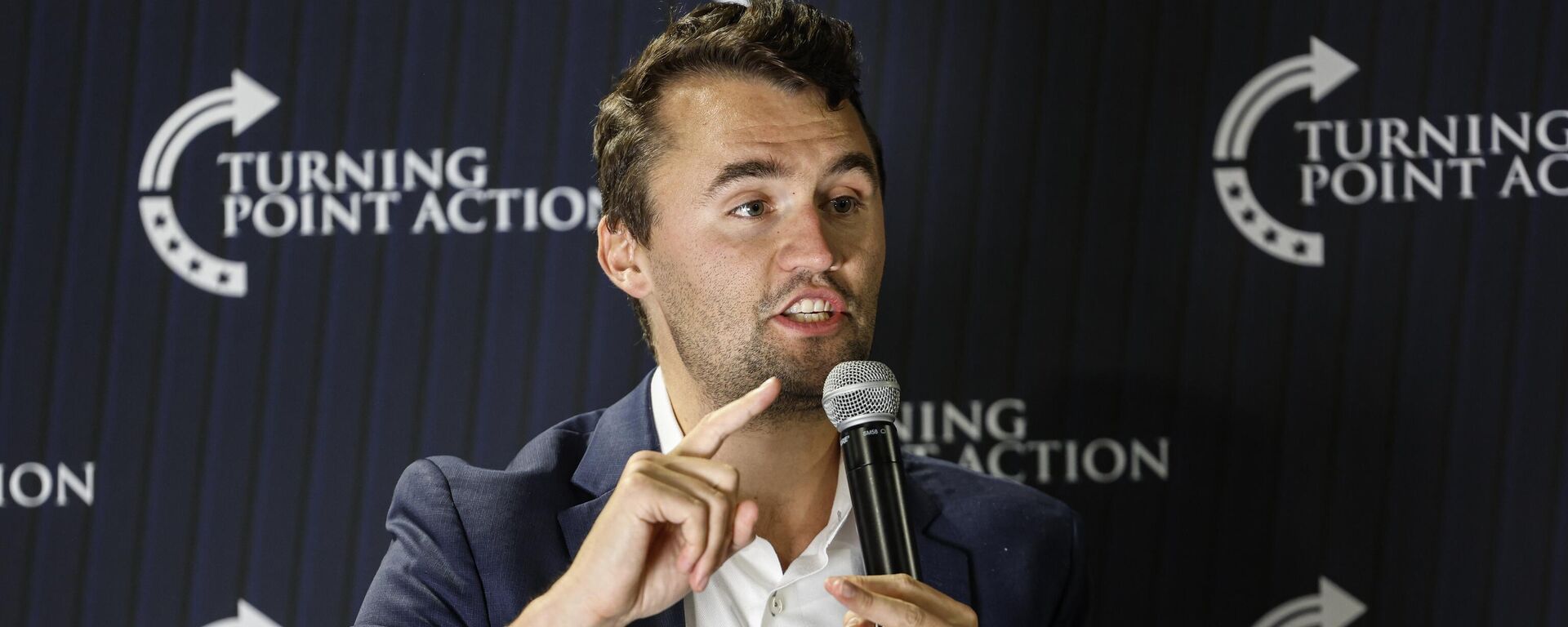 Conservative activist Charlie Kirk speaks during a town hall Monday, March 17, 2025, in Oconomowoc, Wis - Sputnik International, 1920, 11.09.2025