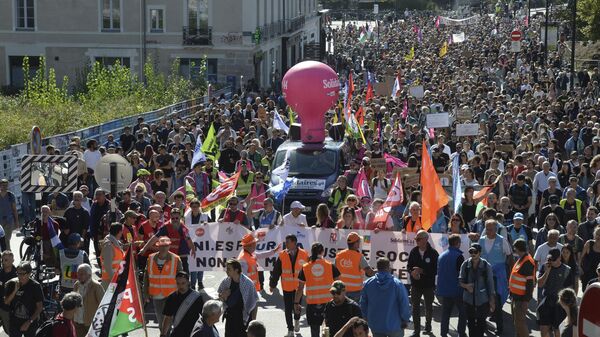 Demonstrators march during a protest called by major trade unions to oppose budget cuts, in Nantes, western France, Thursday, Sept. 18, 2025. - Sputnik International