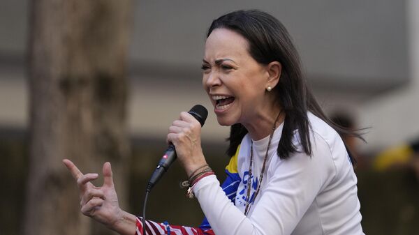 Opposition leader Maria Corina Machado addresses supporters during a protest against President Nicolas Maduro the day before his inauguration for a third term in Caracas, Venezuela, Thursday, Jan. 9, 2025. (AP Photo/Matias Delacroix) - Sputnik International