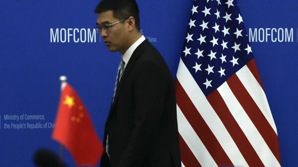 The China and US national flags before a meeting between Commerce Secretary Gina Raimondo and Chinese Minister of Commerce Wang Wentao at the Ministry of Commerce - Sputnik International