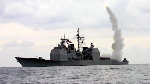 A Tomahawk Land Attack Missile (TLAM) launches from the guided missile cruiser USS Cape St. George (CG 71), in operation in the Mediterranean Sea, on March 23, 2003 - Sputnik International