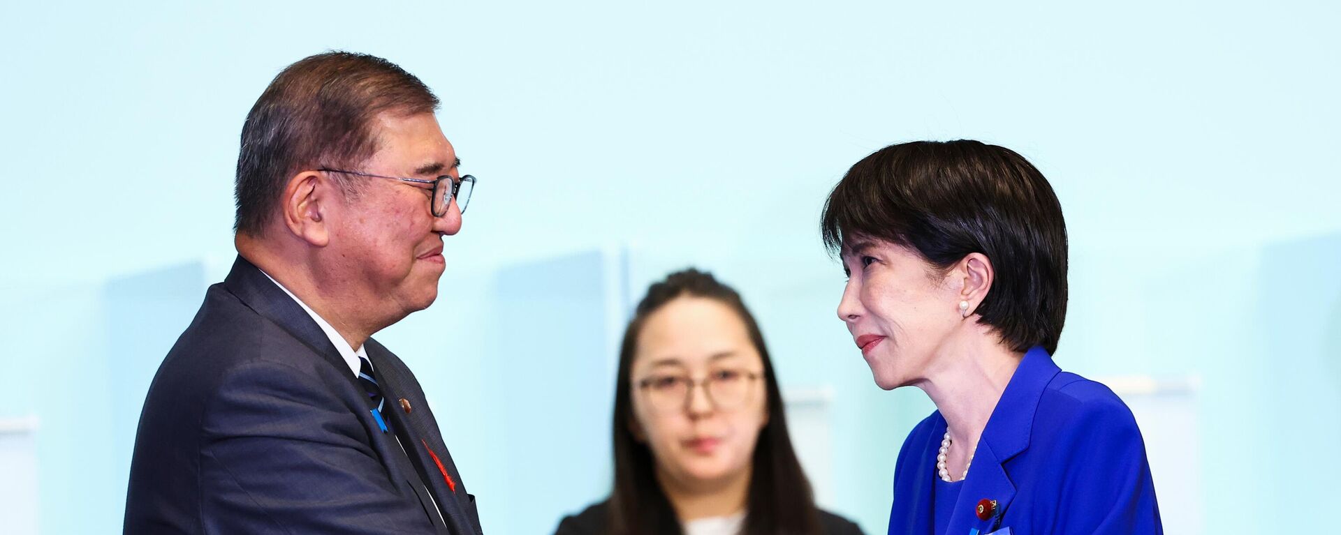 Newly-elected leader of Japan's Liberal Democratic Party (LDP) Sanae Takaichi, right, shakes hands with Prime Minister Shigeru Ishiba after winning the LDP leadership election i in Tokyo, Japan, Saturday, Oct. 4, 2025 Newly-elected leader of Japan's Liberal Democratic Party (LDP) Sanae Takaichi, right, shakes hands with Prime Minister Shigeru Ishiba after winning the LDP leadership election i in Tokyo, Japan, Saturday, Oct. 4, 2025 - Sputnik International, 1920, 21.10.2025