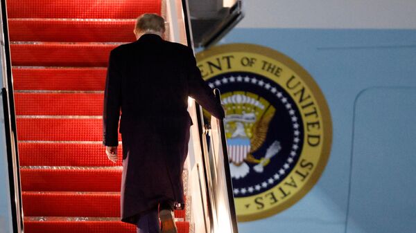 President Donald Trump walks up the stairs of Air Force One as he boards upon his arrival at Joint Base Andrews, Md., Friday, Oct. 24, 2025.  - Sputnik International