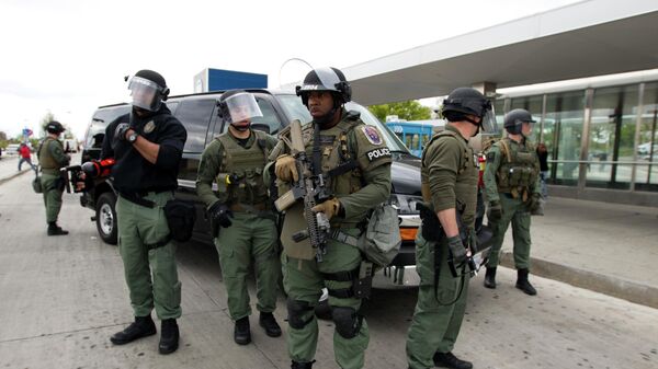 Baltimore police officers respond to demonstrators who were throwing objects at police after the funeral of Freddie Gray, Monday, April 27, 2015, in Baltimore - Sputnik International