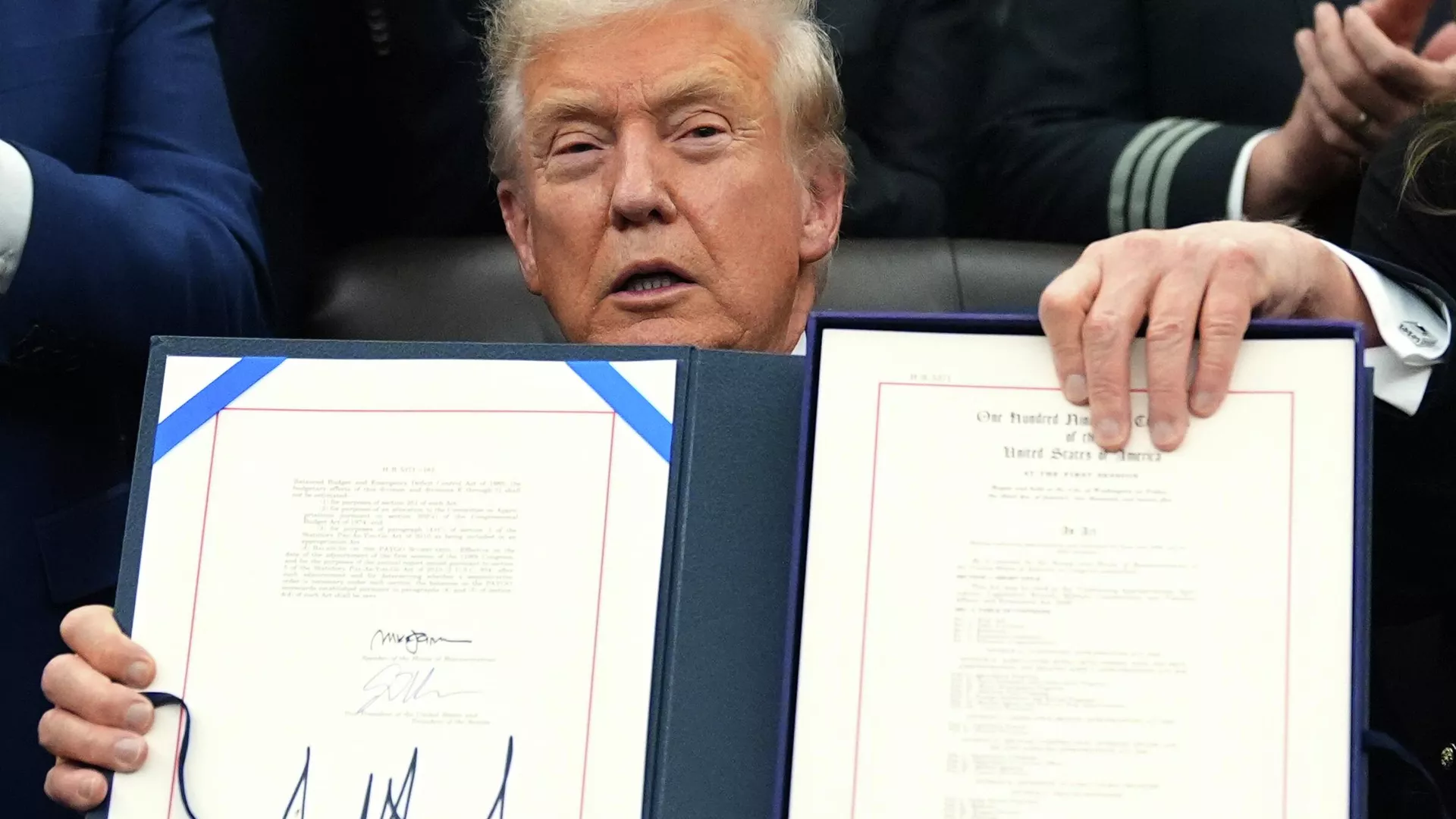 President Donald Trump displays the signed the funding bill to reopen the government, in the Oval Office of the White House, Wednesday, Nov. 12, 2025, in Washington. - Sputnik International, 1920, 07.02.2026