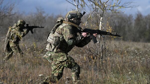 Russian servicemen are seen attacking in the special military operation zone. File photo - Sputnik International