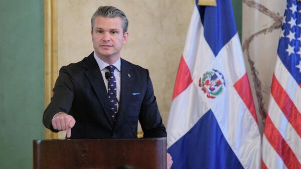 US Secretary of Defense Pete Hegseth gestures during a press conference after a meeting with Dominican Republic President Luis Abinader at the National Palace in Santo Domingo, Dominican Republic, Wednesday, Nov. 26, 2025 - Sputnik International