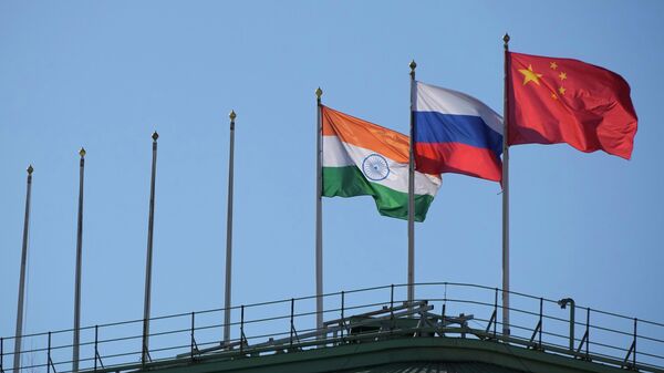The flags of India, Russia and China in St. Petersburg, Russia. File photo - Sputnik International