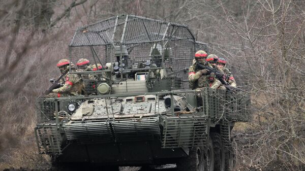 Russian BTR-82A armored personnel carrier with anti-drone mesh in Donetsk People's Republic. January 28, 2025 - Sputnik International