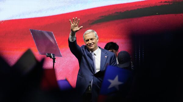 Jose Antonio Kast, leader of the Republican Party, waves after winning the presidential runoff election in Chile - Sputnik International