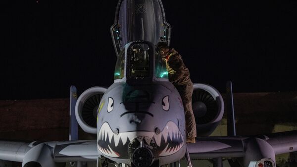 This photo provided by the US Air Force shows a US Airman preparing an A-10 Thunderbolt II for flight from a base in the US Central Command area of responsibility, Friday, Dec. 19, 2025, in support of Operation Hawkeye Strike - Sputnik International
