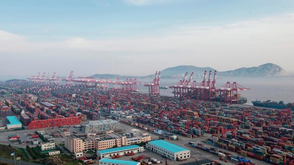 FILE - In this, March 29, 2018, file photo, a container ship is docked at the Yangshan port in Shanghai.  - Sputnik International