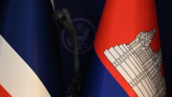 The flags of Thailand, left, and Cambodia, right, are seen ahead of the ceremonial signing of a ceasefire agreement between Thailand and Cambodia on the sidelines of the 47th Association of Southeast Asian Nations (ASEAN) summit in Kuala Lumpur, Malaysia, Sunday, Oct. 26, 2025 - Sputnik International