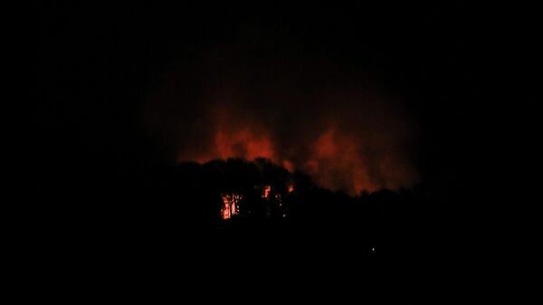 Smoke rises near Fort Tiuna, a military zone, during a full blackout, following explosions and loud noises, amid rising tensions between administrations of U.S. President Donald Trump and Venezuelan President Nicolas Maduro, in Caracas, Venezuela, January 3, 2026.  - Sputnik International