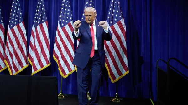 President Donald Trump dances as he walks off stage after speaking to House Republican lawmakers during their annual policy retreat, Tuesday, Jan. 6, 2026, in Washington - Sputnik International