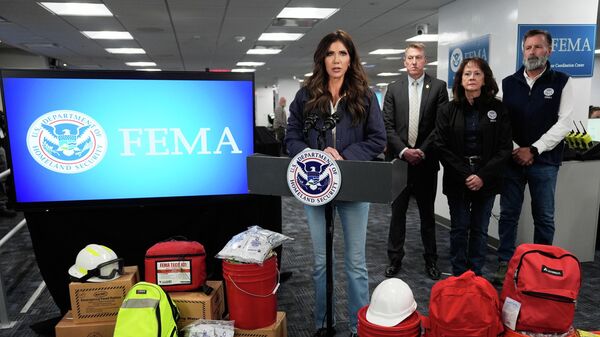 Homeland Security Secretary Kristi Noem speaks during a news conference at Federal Emergency Management Agency headquarters, Saturday, Jan. 24, 2026, in Washington - Sputnik International
