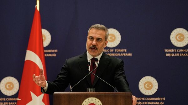 Turkiye's Foreign Minister Hakan Fidan answers questions from reporters during a news conference in Istanbul, Turkiye, Thursday, Jan. 15, 2026 - Sputnik International