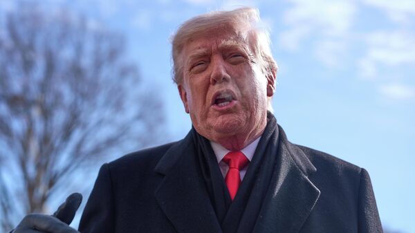 President Donald Trump speaks with reporters before boarding Marine One on South Lawn of the White House, Tuesday, Jan. 27, 2026, in Washington - Sputnik International