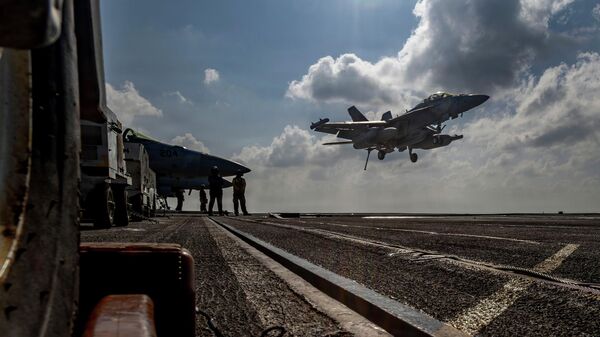 This handout image from the US Navy shows an EA-18G Growler landing on the flight deck of the Nimitz-class aircraft carrier USS Abraham Lincoln in the Indian Ocean on Jan. 23, 2026 - Sputnik International